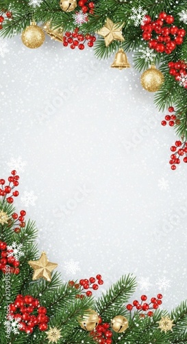 Christmas and New Year festive frame with fir branches, red berries, and golden ornaments on a white background with copy space.