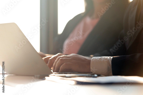 Obraz na płótnie Businessman and businesswoman working with laptop computer in modern office