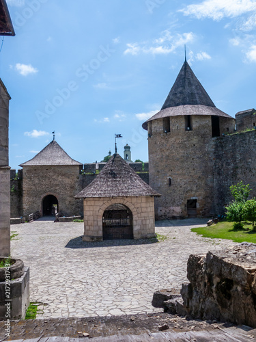 Exploring the historic Khotyn fortress in Khotyn, Ukraine on a clear day with blue sky and warm sunlight