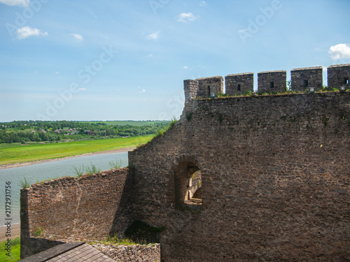 View of Khotyn fortress along the river bank in Khotyn, Ukraine during a bright day