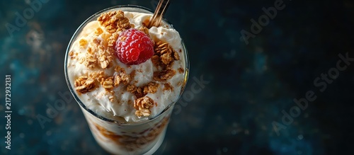 Creamy Dessert Parfait With Granola And Raspberry On Top