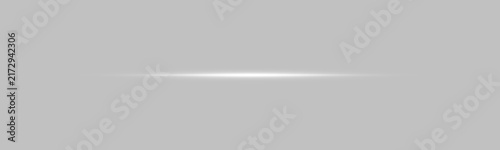 Fotografie A slim horizontal white light beam glows softly in the center against a deep black background