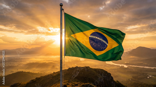 Brazilian Flag Waving on a Pole at Sunrise