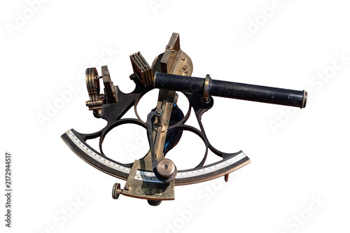 Vintage brass sextant isolated on a white background, serving as a classic nautical navigation tool for measuring angles in maritime history