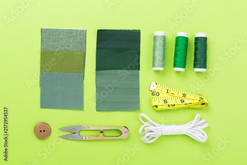 Obraz na plátne Sewing and needlework accessories on color background, top view