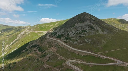 Transalpina Road Wrapping Around Rocky Peak
