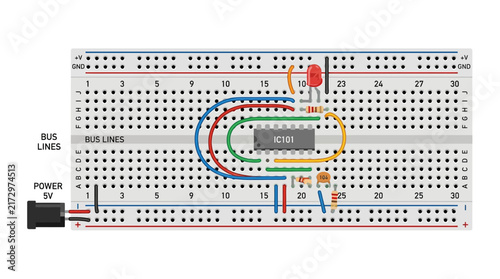 фотографія Electronic Circuit on Breadboard with LED and Integrated Circuit