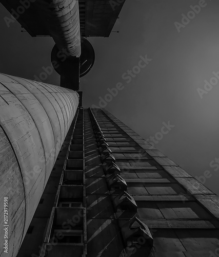 BELGRADE, SERBIA - AUGUST 24, 2026: Low angle view of the famous Genex Tower, a classic brutalist concrete skyscraper under a clear sky in New Belgrade.