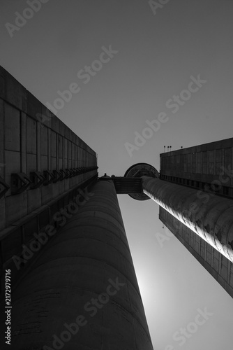 BELGRADE, SERBIA - AUGUST 24, 2026: Low angle view of the famous Genex Tower, a classic brutalist concrete skyscraper under a clear sky in New Belgrade.