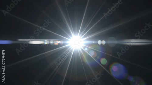 Bright white light burst overlay effect with ray on a dark background