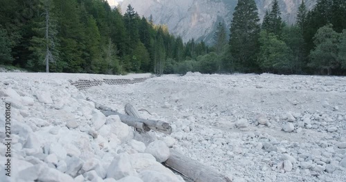 Almost completely dry riverbed of Pišnica alpine river in Slovenia, Europe, during Summer heatwave