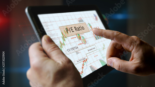 Stock market indices charts graphs on touchscreen pad display