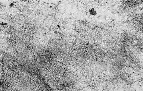 abstract grunge texture showcasing a rough concrete and plaster wall with dynamic diagonal brush marks, subtle cracks, and naturally weathered details.