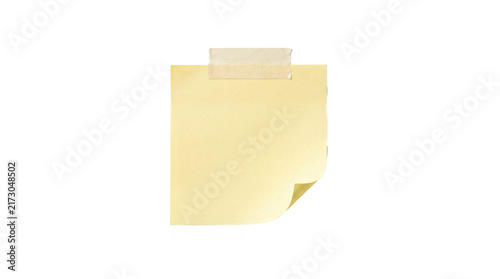 Obraz na płótnie Blank yellow sticky paper note attached with masking tape showing a curled corne