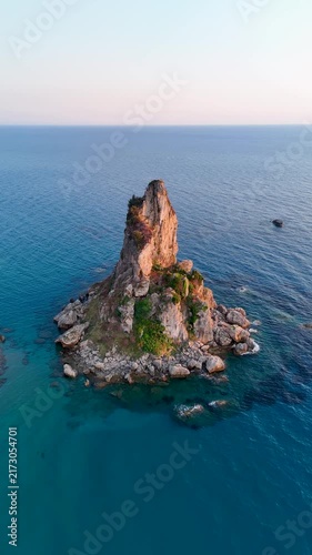 Rocky islet in the Ionian sea at sunrise in Corfu Greece