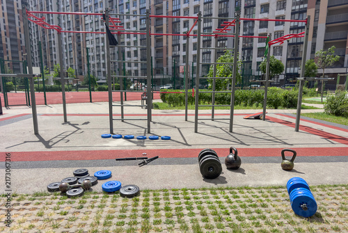 Obraz na płótnie Outdoor fitness workout area with strength training equipment calisthenics bars