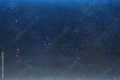 Blank grained film strip texture background with heavy grain, dust and light leak