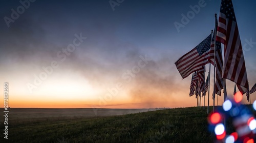Photography A row of american flags waving during a beautiful sunset to honor fallen soldier