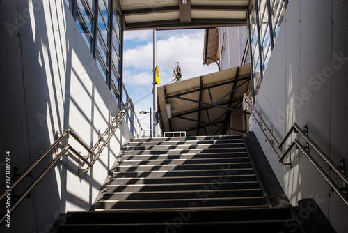 Modern Concrete Staircase with Stainless Steel Handrails at Railway Station Underground Passage Exit