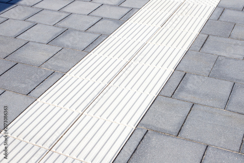 White Tactile Guidance Paving Line on Railway Station Platform
