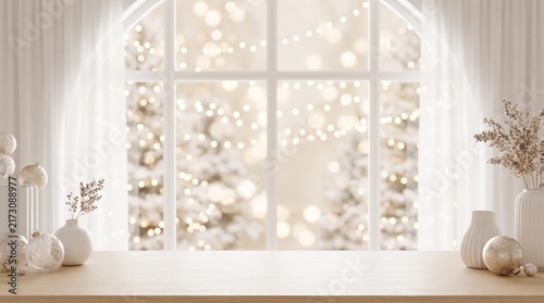 Elegant white Christmas interior with a bright window, snowy outdoor scenery, soft golden bokeh lights, white ornaments, decorative branches, and a clean wooden tabletop with generous copy space.