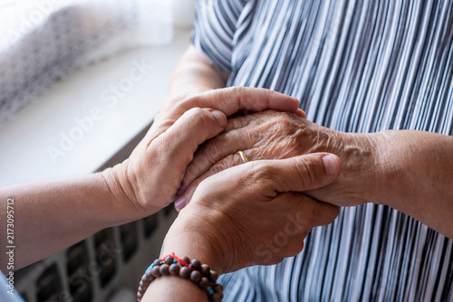 Konstfotografi Two sets of hands holding each other, representing care, empathy, and comfort be