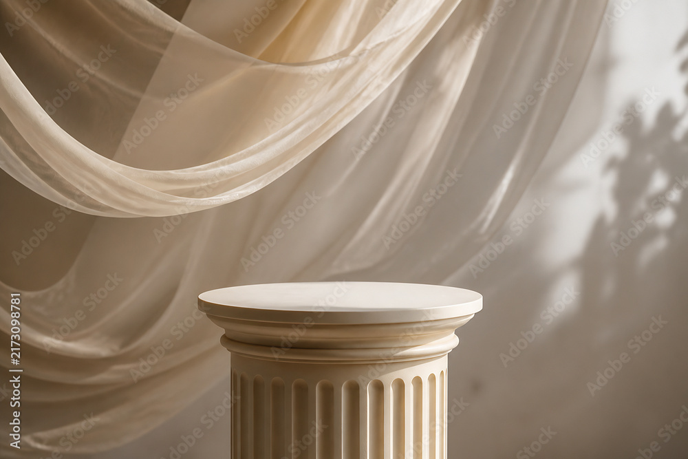 Naklejka premium A round pedestal stands in front of draped, flowing beige curtains indoors.