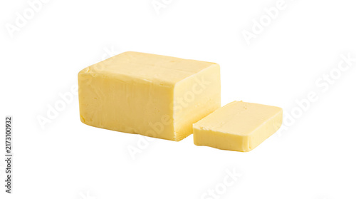 Fotografie Fresh yellow butter block cut into thin slices on white background