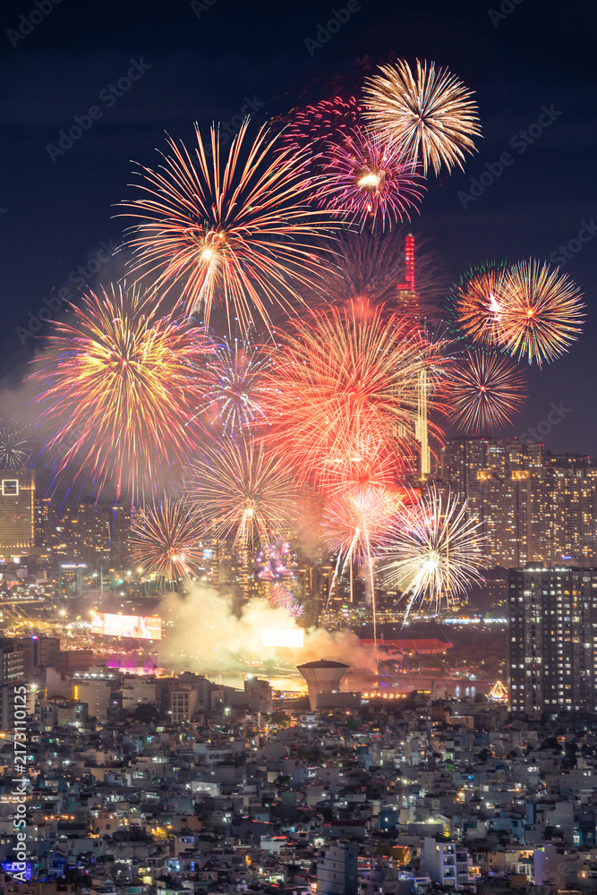 Obraz premium Celebration. Aerial view of skyline with fireworks light up sky over Ho Chi Minh City ( Saigon ), Vietnam. Beautiful night view cityscape.