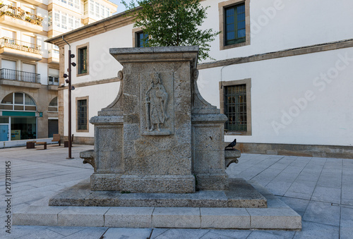 Historic stone fountain in Praza de Ferrol public square in Lugo Spain