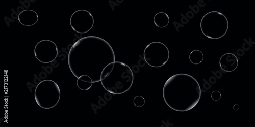Foto A collection of isolated transparent water bubble elements floating against a cl