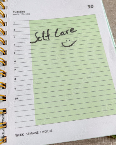 Self Care Written in Planner with Smiley Face