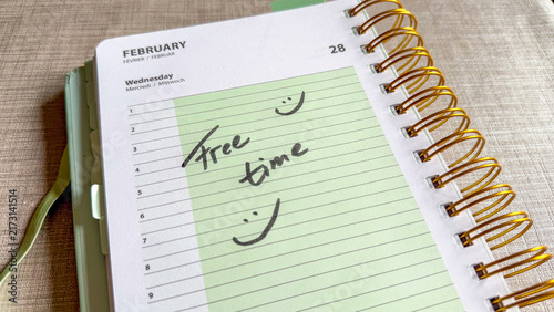 Free Time Written in Weekly Planner with Smiley Faces