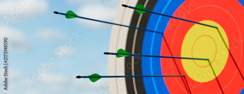 Archery target with multiple arrows hitting the bullseye representing business success
