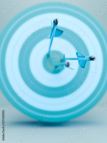 Принти на полотні Three blue arrows perfectly hitting the bullseye on a light blue target board
