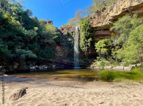 Chorro San Luis waterfall in Chiquitania region in Bolivia, surrounded by lush tropical vegetation and rugged natural scenery.