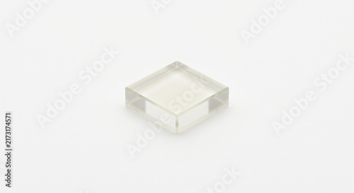 Macro photograph of a single TLD dosimeter crystal. Translucent lithium fluoride solid state square crystal for ionizing radiation capture and health physics. Isolated on white.