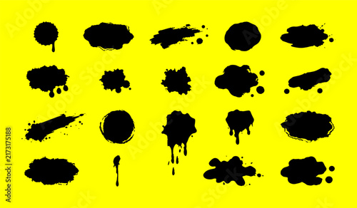 Assorted black paint splatters and abstract shapes on yellow backdrop