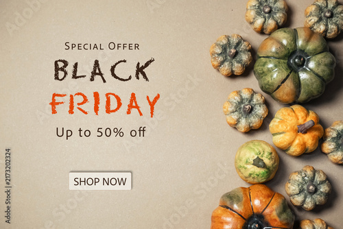 Black Friday sale advertisement featuring decorative pumpkins on a beige background, highlighting a special offer of up to 50 off.