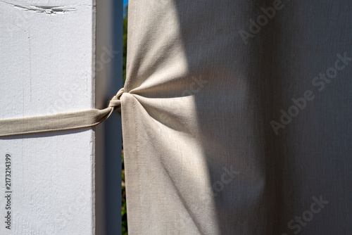 Textile detail tied to wooden structure