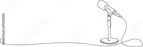 continuous line drawing of a microphone on a desktop stand with copy space. podcasting and audio recording concept, line art vector illustration