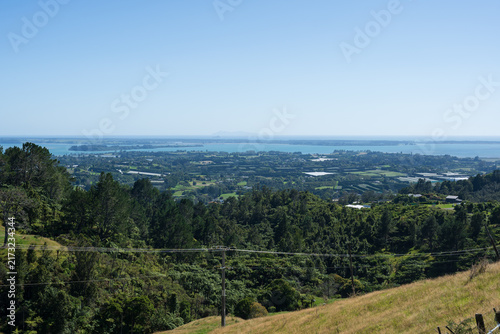 Ōmokoroa hillside overlooking coastal farmland and bay
