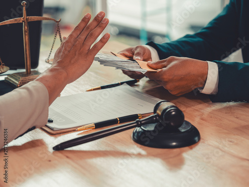 Quadro su tela Lawyer hand gesturing stop to refuse money cash bribe offered by client in offic
