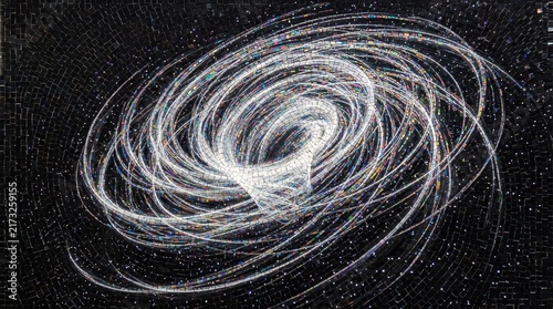 Light trails create a complex spiral pattern over a textured grainy surface.