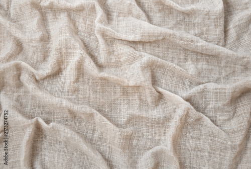 Wrinkled linen fabric with rough texture as a background