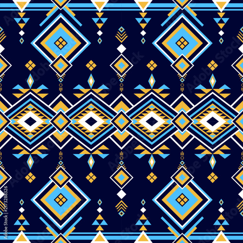 Blue and yellow geometric tribal pattern on dark blue background.
