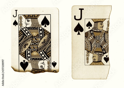 Photography Partly burnt and torn vintage playing cards in sepia isolated on a white background