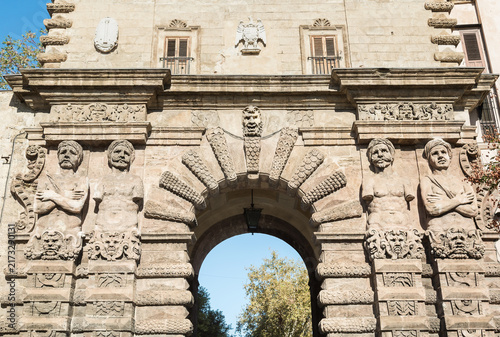 Exterior facade of Porta Nuova, a monumental historic triumphal arch located beside the Norman Palace in Palermo, Sicily, Italy