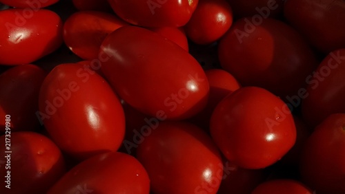 Photography Fresh red cherry tomatoes fill the frame in a close view