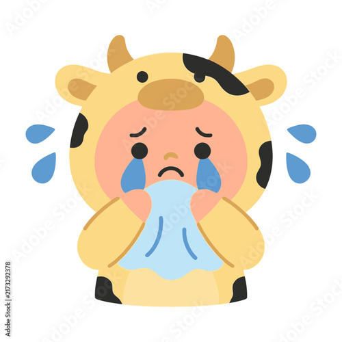 Bild auf Leinwand Cute crying baby in cow costume wiping tears with blue handkerchief